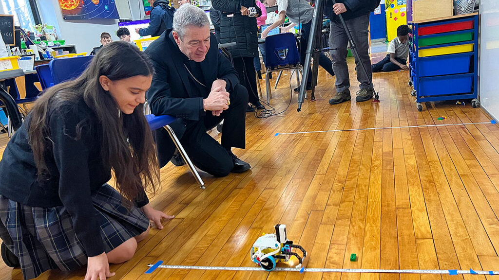 Bishop brennan has expressed his fascination with the robotics program at bay ridge catholic academy kat
