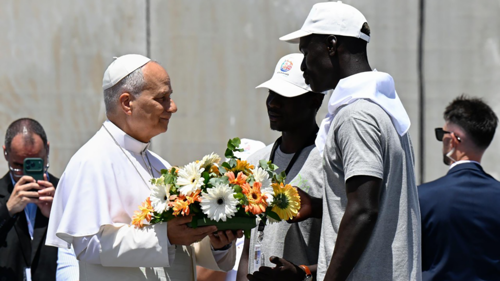 Pope and migrants head