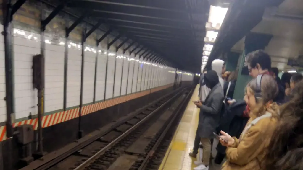 NYC commuters waiting in station