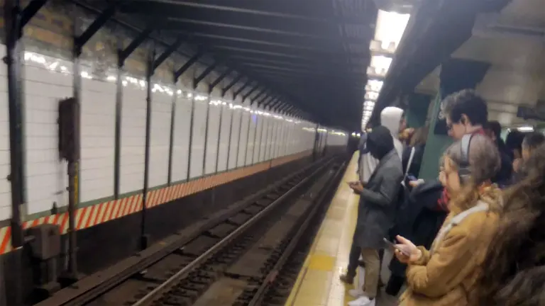 NYC commuters waiting in station