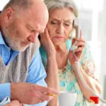 Senior checks Annual Notice of Change letter before Medicare 2027 enrollment