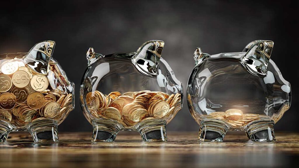 Glass jars filled with coins – protecting savings from inflation