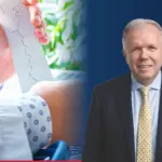 Dr Adam S. Budzikowski, kardiolog, obok zdjęcia zapisu EKG