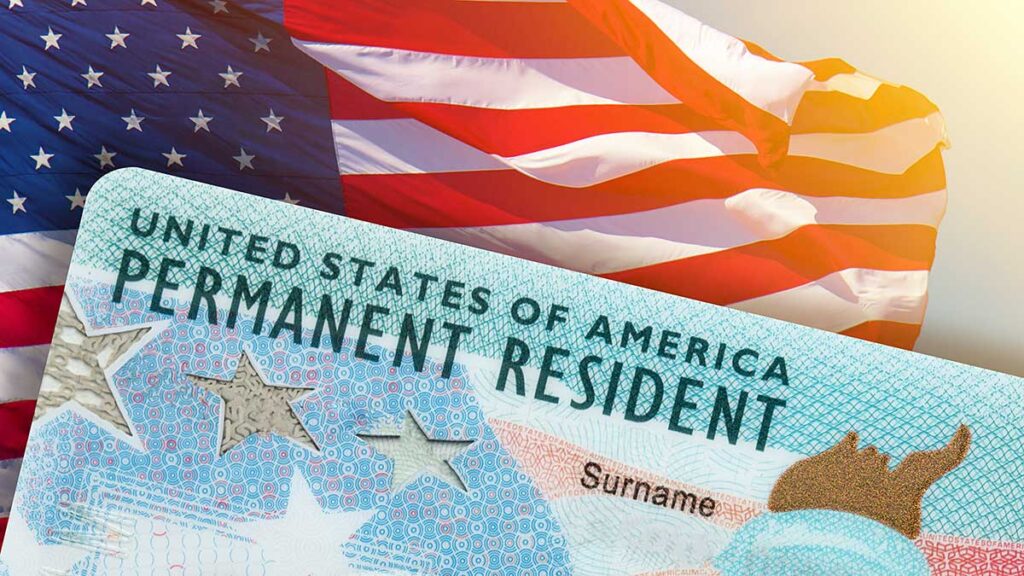Permanent resident card on the U.S. flag – giving up a green card