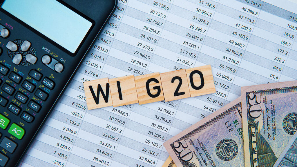WIG20 letters, calculator and banknotes – investing in Poland